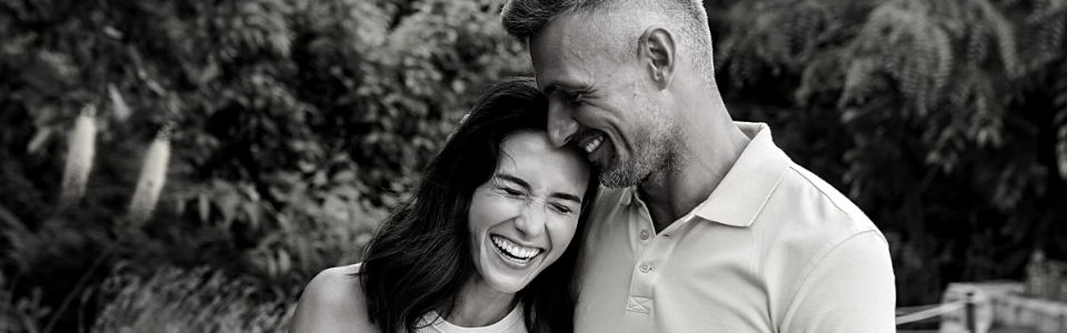 middle age runners in casual clothes smiling after finishing a run